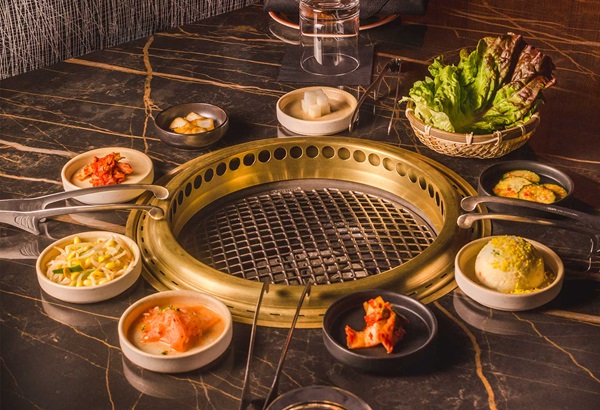 Bae Korean Grill spread of food to cook on grill